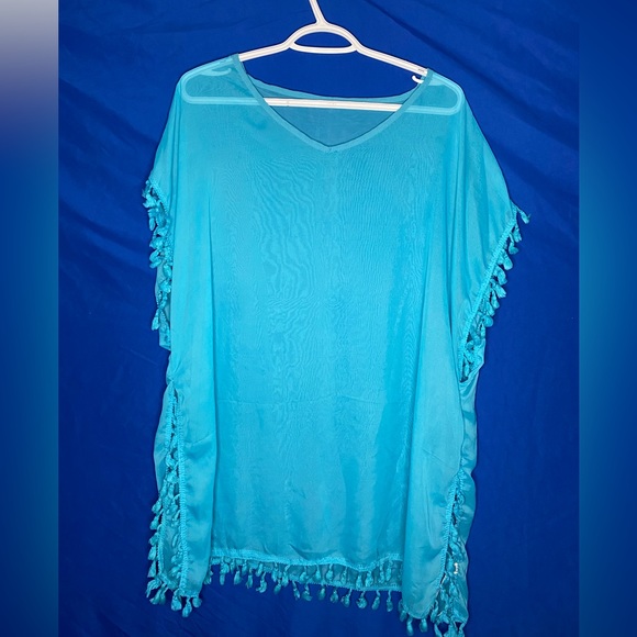 Light blue synthetic cover up in good condition. (Worn: 0) - Picture 2 of 2